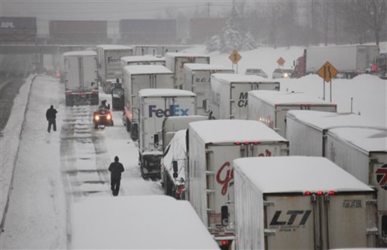 Vehicles shown stranded on the New York State Thruway during a winter storm in Buffalo Thursday.